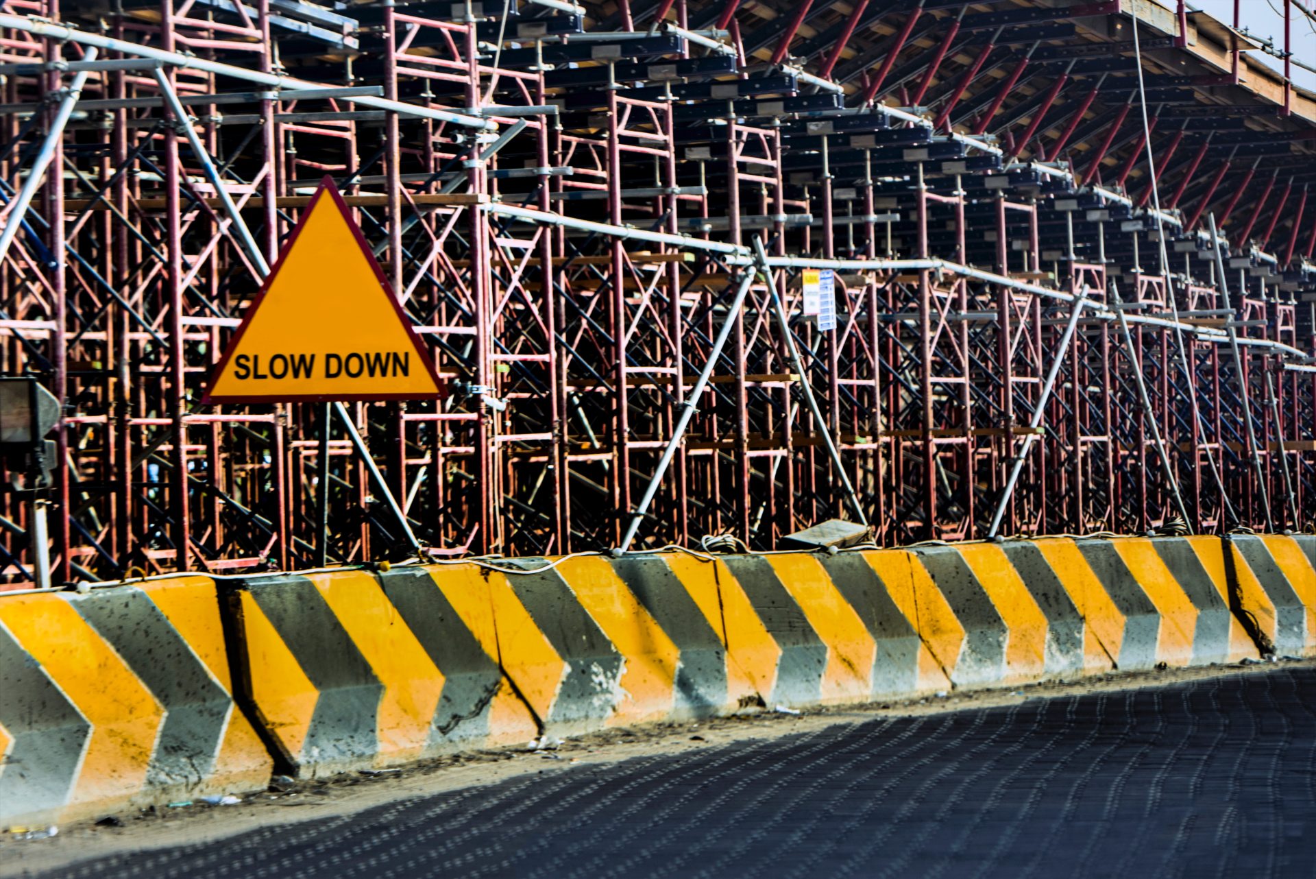 slow down sign on scaffolding