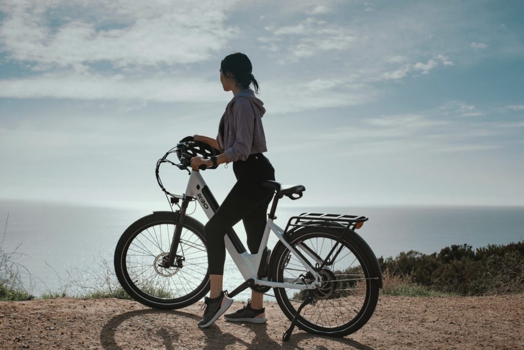 woman on e-bike on the coast